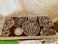 All seven pressed-glass pieces arranged for overview