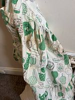 white apron with green novelty kitchen print