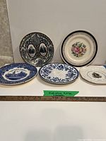 All five plates aligned to show fronts and relative size