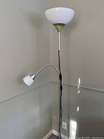 Full view of lamp showing torchiere shade, gooseneck reading light, pole and base