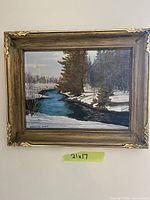 Framed painting on wall showing full view and size tape 21x17