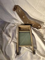 Front view of PEARL wooden washboard and wooden sock dryer paddle
