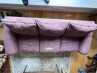 Top view of entire sofa showing three back cushions and overall fabric pattern