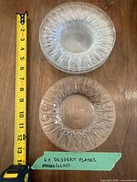 Top view of measuring tape and stacked plates showing diameter and pattern