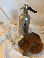 All items in lot: soda siphon, two glasses, wooden dish, toothpick holder