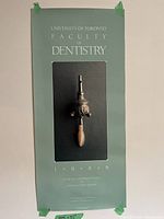 Full view of one poster showing layout, color, and dental instrument image