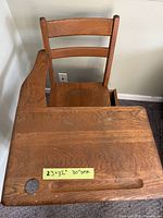 Top view of desk showing desktop surface, attached chair back, cable hole, pencil groove, measurement note 23×32 in