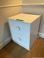 front view of white three-drawer chest