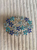 Front view showing floral rhinestone design and colors