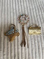 All three brooches front view