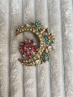 Front view showing rhinestone arrangement and missing stones