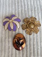 Front view of all three brooches