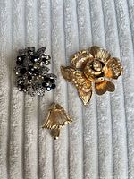 Group shot showing all three brooches