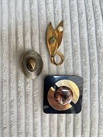 Front view of the three brooches