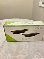 Front of Burnes Level-Line box displaying two black ledges and size information