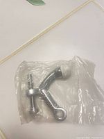 Door stopper with rubber tip and screw in plastic sleeve, overall view