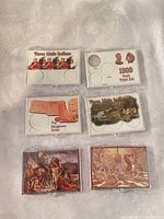 All six plastic coin holders with themed inserts displayed front side up