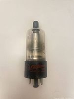 Full view of GE 1B3GT vacuum tube showing glass envelope and base branding