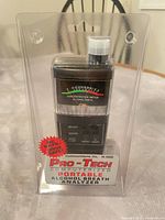 Front view of sealed Pro-Tech H-1000 breathalyzer showing analog meter and branding