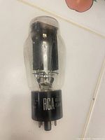 Front view of RCA 5U4G vacuum tube showing glass envelope, internal plates, and labeled black base
