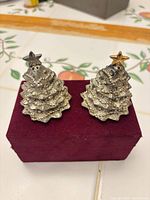 Front view of both Christmas tree shakers on box