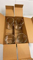 Four beakers inside original cardboard divider box