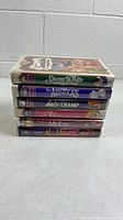 Stack of six Disney VHS clamshell cases