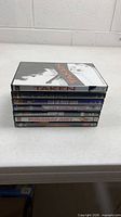 Stack of seven DVD cases side view showing titles