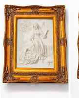 Front view of framed alabaster relief showing classical scene and ornate gilt frame