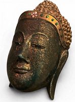 Oblique view showing patina, gilded crown, side profile