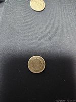 Reverse of 1859 Indian Head cent showing ONE CENT wreath design, worn