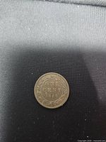 Reverse of 1888 Canadian 1-cent coin showing ONE CENT 1888 within wreath