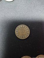 Reverse of 1888 Canadian one cent coin showing wreath and date