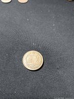 Reverse of 1927 Confederation medal showing coat of arms