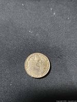 Reverse side showing crowned monogram, dates and legend