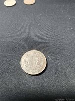 Obverse showing coat of arms design