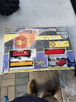 Front of Bachmann Meteor box showing locomotive, caboose and gondola