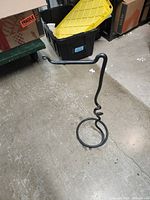 Full view of black wrought iron plant hanger stand