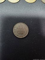 Reverse of 1900 Canadian one cent coin showing ONE CENT 1900 within vine border