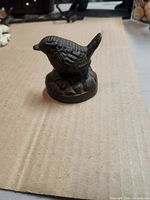 Front view of cast iron bird doorstop