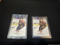 Front view of both Connor McDavid Young Stars cards in top loaders