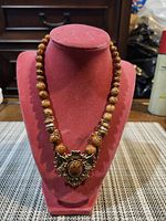 Front view showing full necklace and pendant