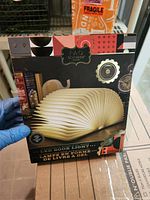 Front of retail box showing FAO Schwarz Wizard of Oz LED Book Light image