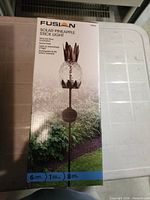 Front of Fusion Solar Pineapple Stick Light box showing product image and details