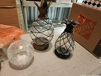 Large and small glass pineapple lamps plus crackle glass globe lamp