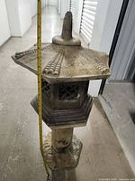 Front view of full lantern with tape measure indicating height