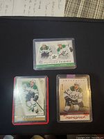 All three sleeved, top-loaded Dallas Stars cards displayed