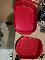 Top view of both red baking dishes showing shape and color
