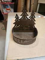 Front view showing bear, trees and welcome text