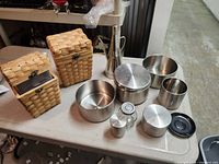 Full lot showing baskets, canisters, pourer, spice jar